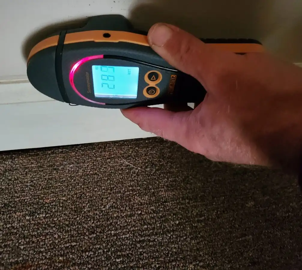 Moisture detection at baseboard during Storm Damage Restoration in Watauga